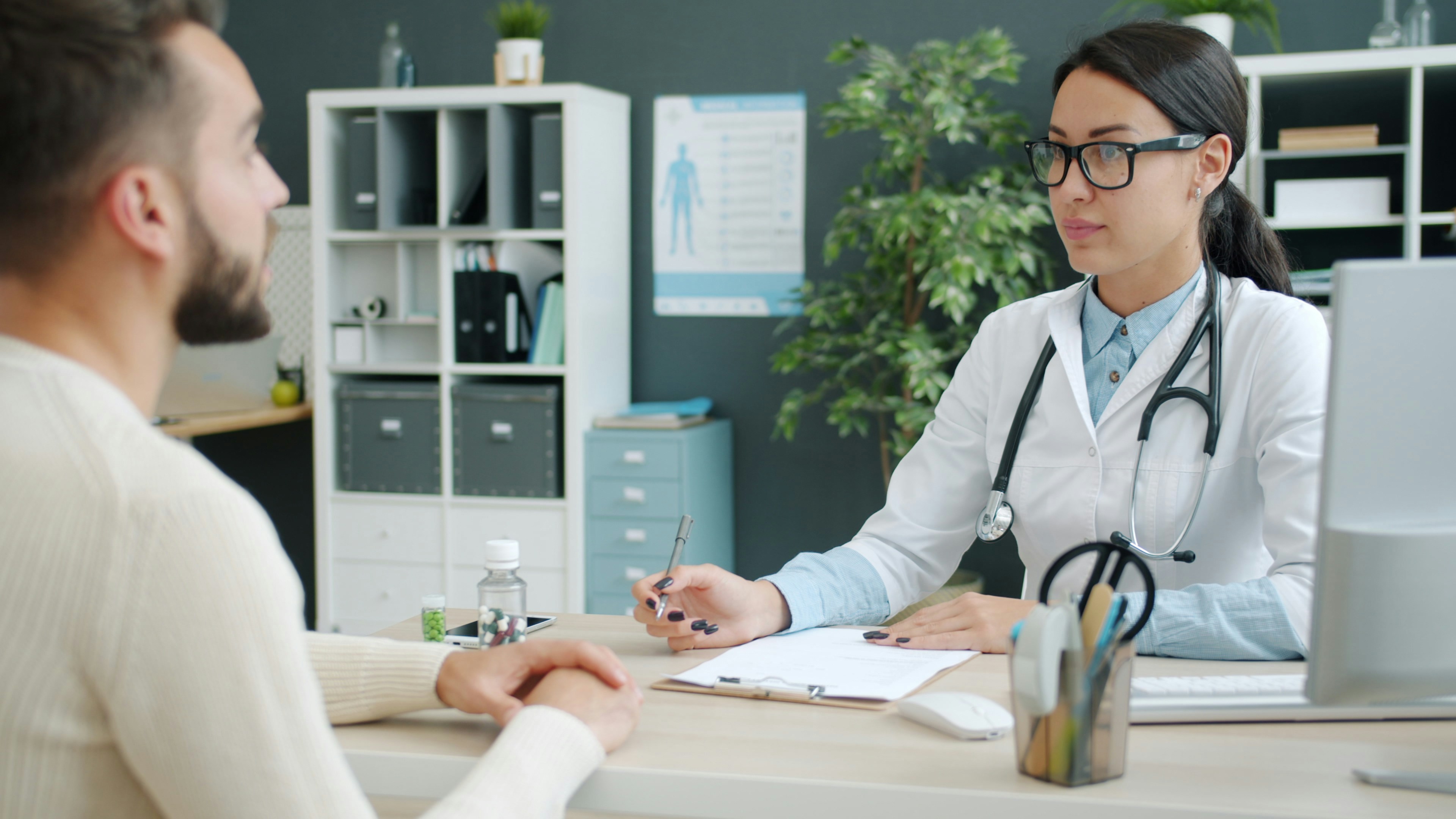 A calm consultation room with natural light, conveying an unhurried conversation with a doctor